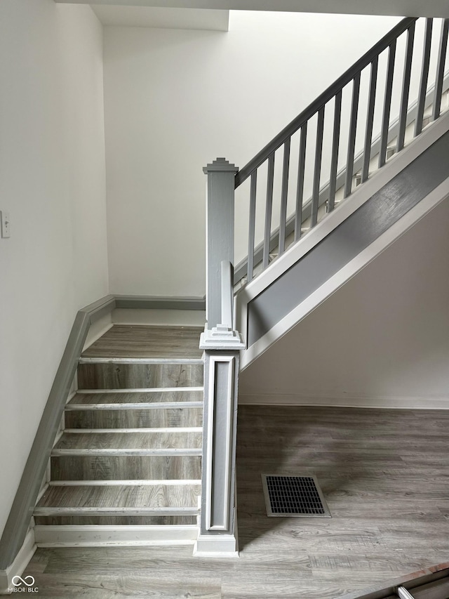 1322 S Belmont Ave, Indianapolis, IN 46221 - staircase featuring wood finished floors and baseboards