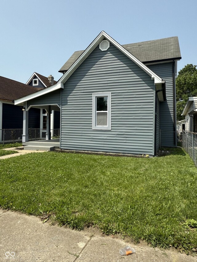 1322 S Belmont Ave, Indianapolis, IN 46221 - view of side of home with roof with shingles