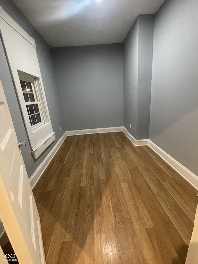 2116 Prospect St, Indianapolis, IN 46203 - unfurnished room with dark wood finished floors and baseboards
