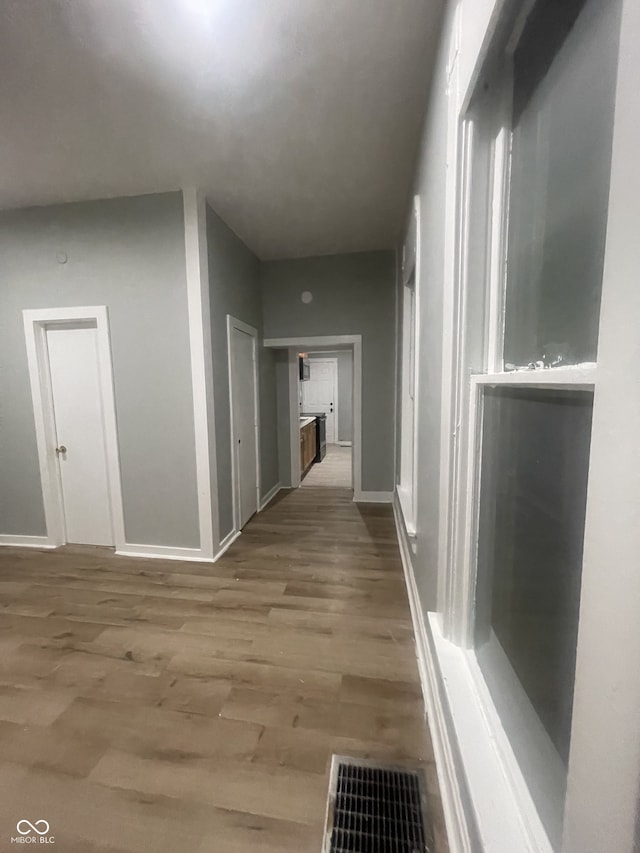 2116 Prospect St, Indianapolis, IN 46203 - corridor featuring baseboards and wood finished floors