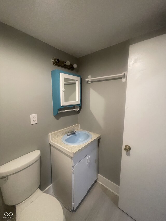 2116 Prospect St, Indianapolis, IN 46203 - bathroom with vanity, toilet, and baseboards