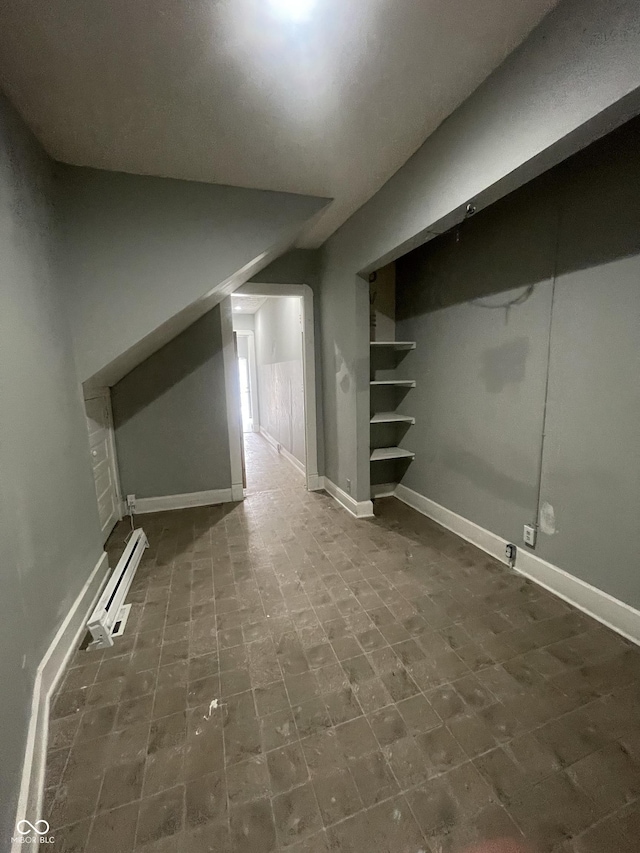 2116 Prospect St, Indianapolis, IN 46203 - basement featuring baseboard heating and baseboards