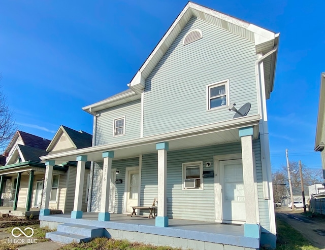 2116 Prospect St, Indianapolis, IN 46203 - rear view of house featuring covered porch and cooling unit