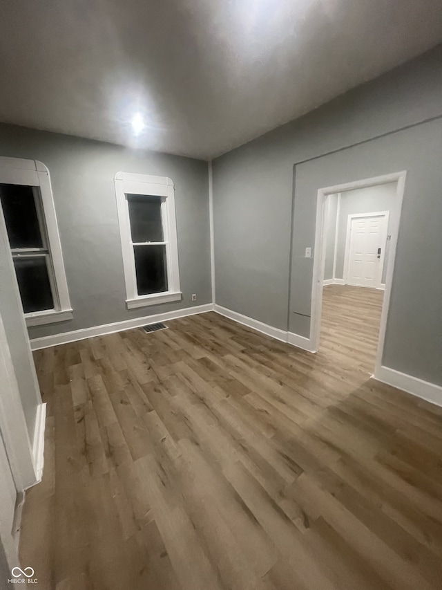 2116 Prospect St, Indianapolis, IN 46203 - spare room with wood finished floors and baseboards