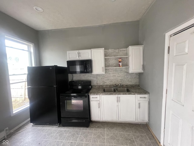 2116 Prospect St, Indianapolis, IN 46203 - kitchen featuring black appliances, a sink, white cabinets, backsplash, and open shelves
