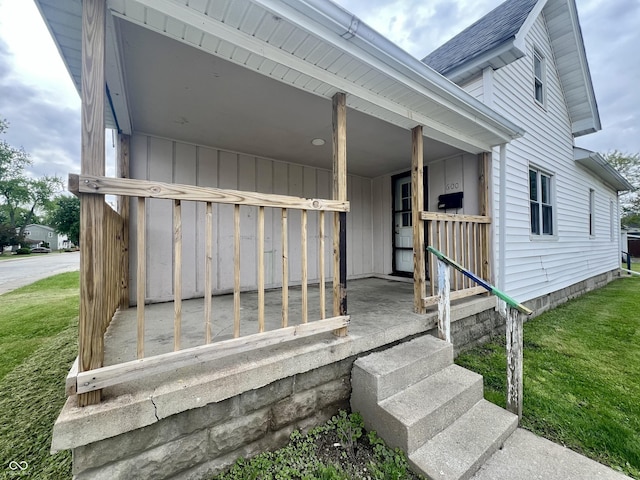 600 S Oak St, Fortville, IN 46040 - view of exterior entry featuring a lawn and roof with shingles