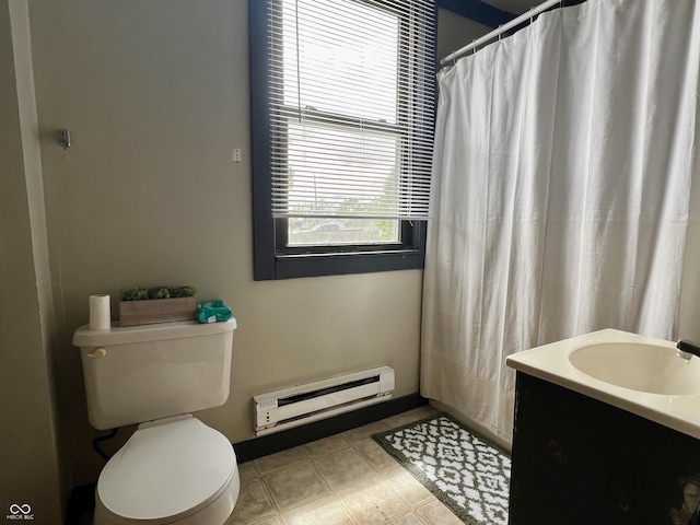 600 S Oak St, Fortville, IN 46040 - bathroom with a baseboard heating unit, toilet, vanity, and a shower with curtain