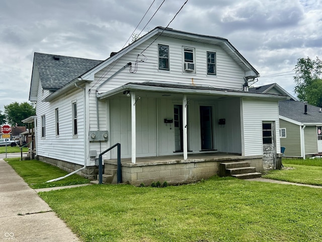 600 S Oak St, Fortville, IN 46040 - view of front facade with covered porch, a front yard, roof with shingles, and cooling unit