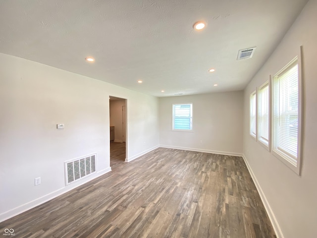 6150 E 25th St, Indianapolis, IN 46219 - spare room with dark wood-type flooring, baseboards, and recessed lighting