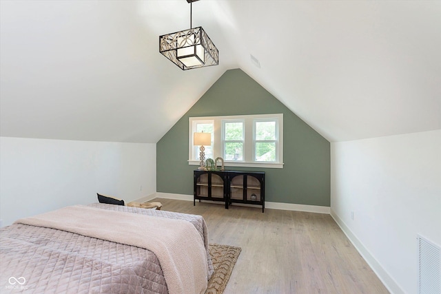 1502 Burdsal Pkwy, Indianapolis, IN 46208 - bedroom featuring light wood finished floors, baseboards, and lofted ceiling