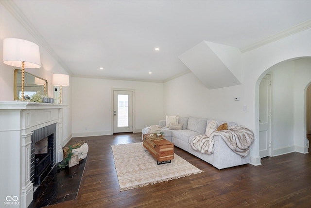 1502 Burdsal Pkwy, Indianapolis, IN 46208 - living room with ornamental molding, arched walkways, a fireplace, baseboards, and dark wood-type flooring