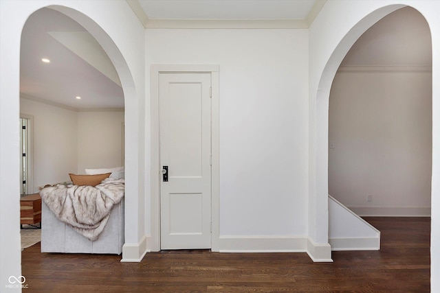 1502 Burdsal Pkwy, Indianapolis, IN 46208 - hallway featuring wood finished floors, ornamental molding, baseboards, recessed lighting, and arched walkways