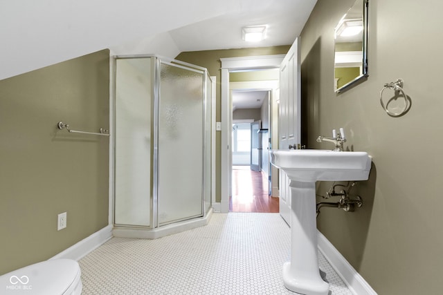 1526 Carrollton Ave, Indianapolis, IN 46202 - bathroom with a stall shower, toilet, and baseboards