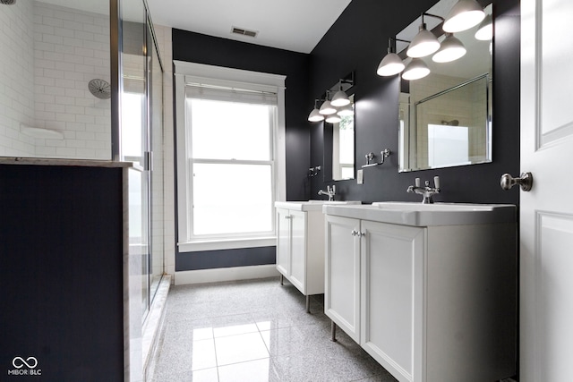 1526 Carrollton Ave, Indianapolis, IN 46202 - full bath with a stall shower, double vanity, and baseboards