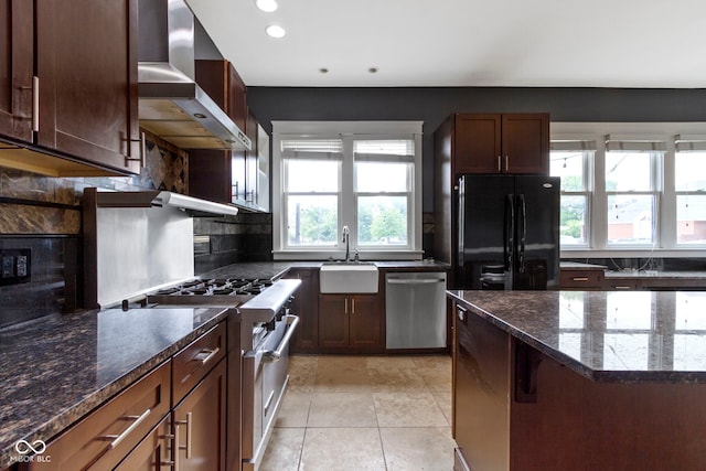 1526 Carrollton Ave, Indianapolis, IN 46202 - kitchen featuring stainless steel appliances, wall chimney exhaust hood, a sink, backsplash, and recessed lighting