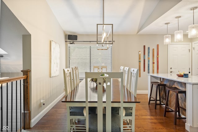 35 Osage Ct, Columbus, IN 47201 - dining room with baseboards, dark wood finished floors, a chandelier, and lofted ceiling