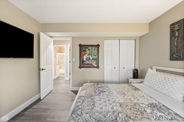 35 Osage Ct, Columbus, IN 47201 - bedroom with wood finished floors, baseboards, and a closet
