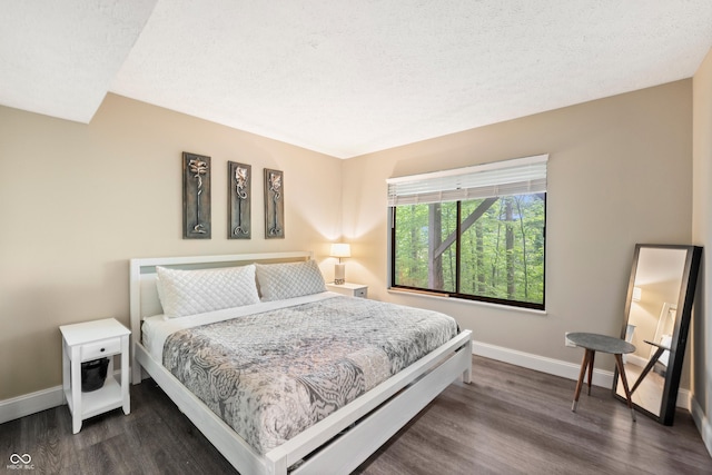 35 Osage Ct, Columbus, IN 47201 - bedroom featuring baseboards and dark wood-type flooring