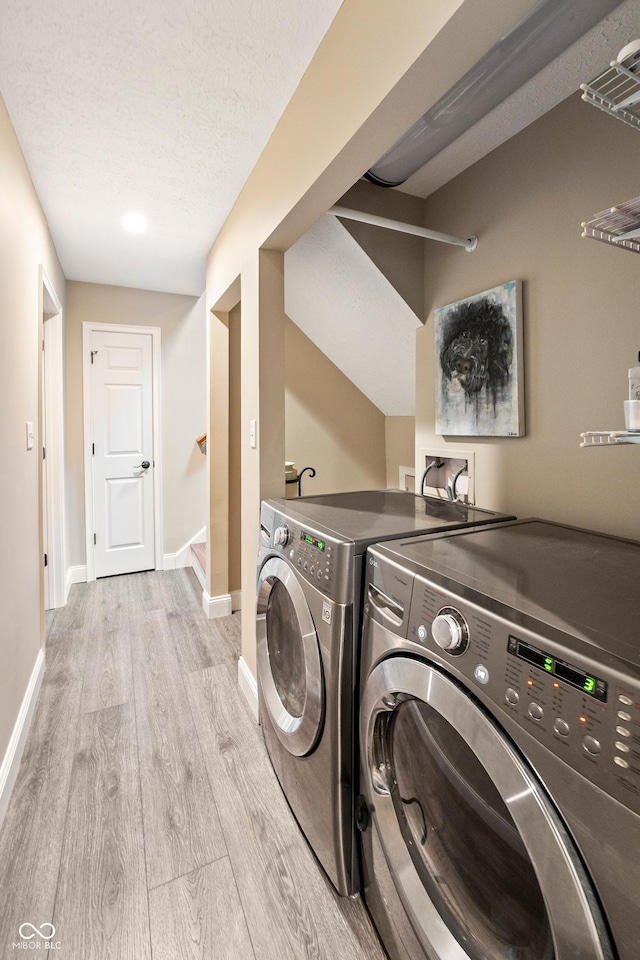 35 Osage Ct, Columbus, IN 47201 - laundry room featuring washer and dryer, light wood-type flooring, and baseboards