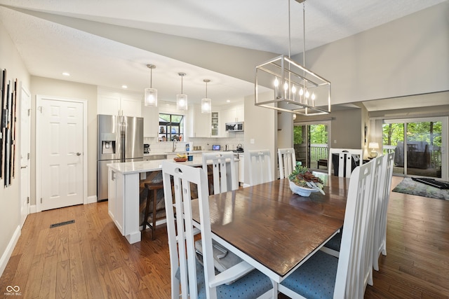 35 Osage Ct, Columbus, IN 47201 - dining space featuring light wood-type flooring, recessed lighting, a chandelier, and baseboards