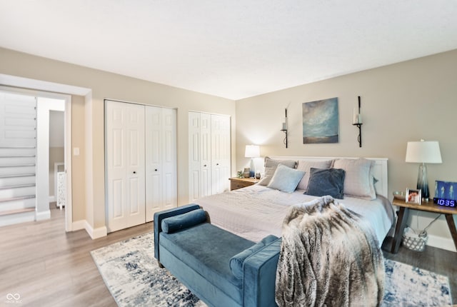 35 Osage Ct, Columbus, IN 47201 - bedroom with multiple closets, wood finished floors, and baseboards
