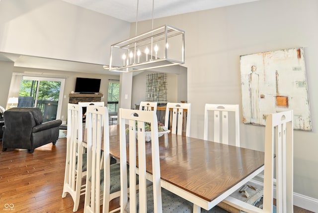 35 Osage Ct, Columbus, IN 47201 - dining area featuring hardwood / wood-style flooring and a chandelier