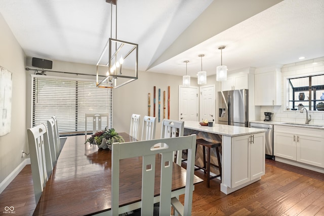 35 Osage Ct, Columbus, IN 47201 - dining space with dark wood finished floors, a chandelier, and baseboards