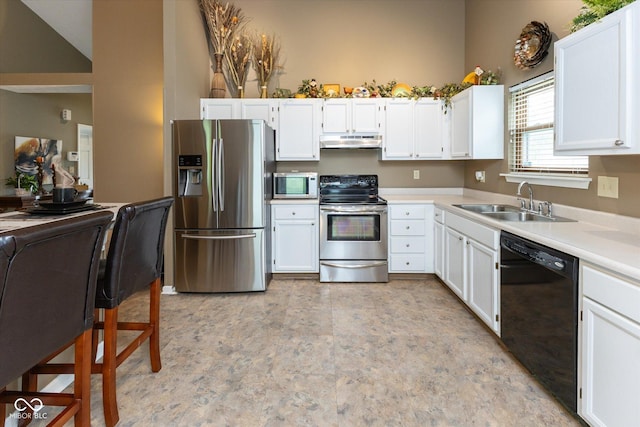 3630 Foxtail Dr, Indianapolis, IN 46235 - kitchen featuring appliances with stainless steel finishes, under cabinet range hood, a sink, white cabinets, and light countertops