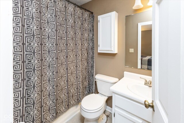 3630 Foxtail Dr, Indianapolis, IN 46235 - bathroom featuring toilet, vanity, curtained shower, and baseboards