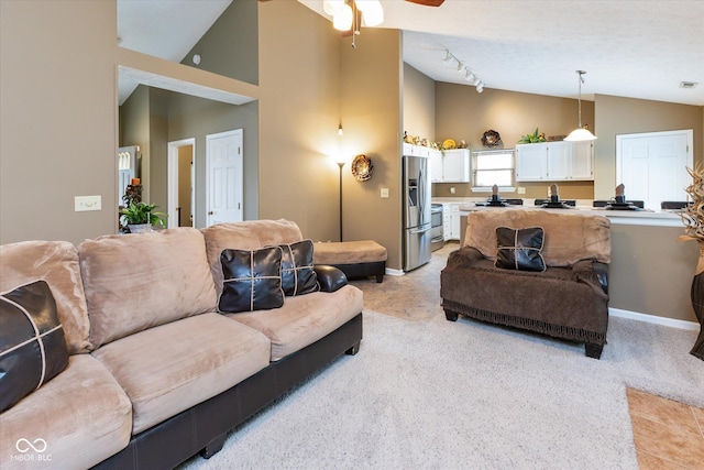 3630 Foxtail Dr, Indianapolis, IN 46235 - living room with light colored carpet, a ceiling fan, baseboards, and high vaulted ceiling