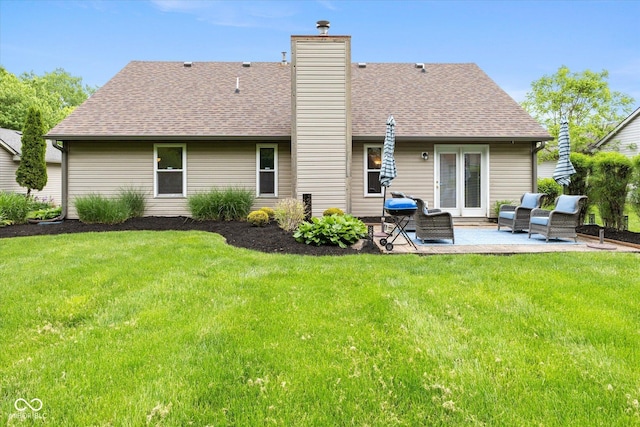 3630 Foxtail Dr, Indianapolis, IN 46235 - rear view of house featuring a patio area, a lawn, and roof with shingles