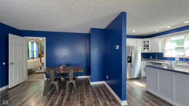 80 E College Ave, Martinsville, IN 46151 - dining room featuring dark wood-type flooring, a textured ceiling, and baseboards