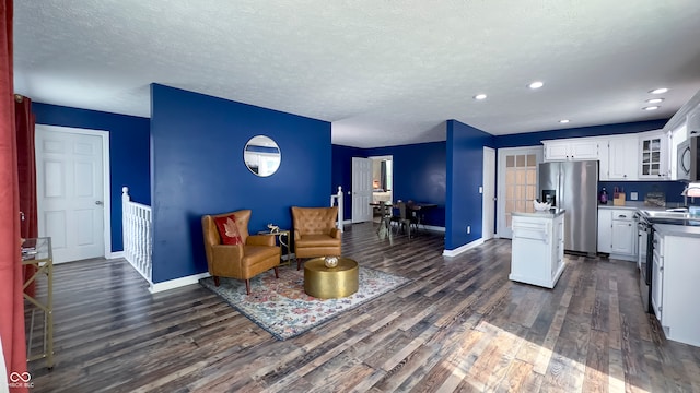 80 E College Ave, Martinsville, IN 46151 - living area with dark wood-style flooring, baseboards, a textured ceiling, and recessed lighting