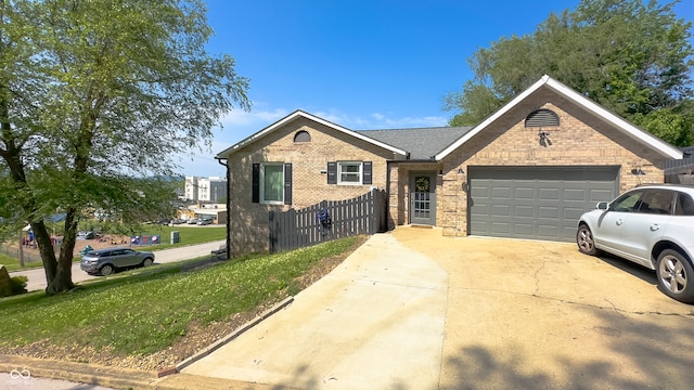 80 E College Ave, Martinsville, IN 46151 - ranch-style home with a garage, brick siding, driveway, and fence