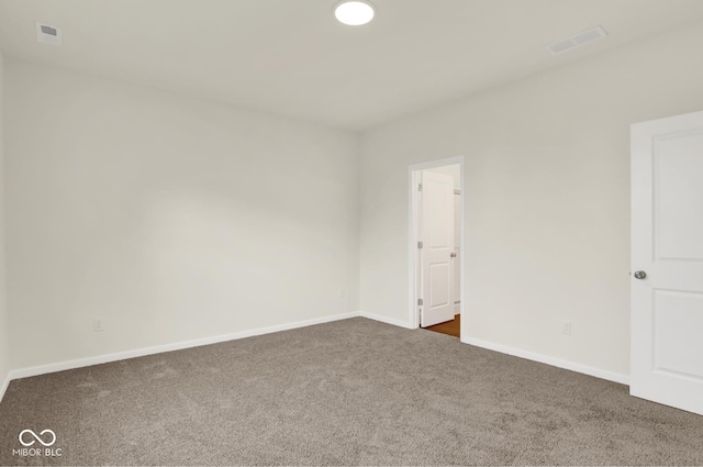 104 Maxim Ct, Cumberland, IN 46229 - spare room featuring dark carpet and baseboards