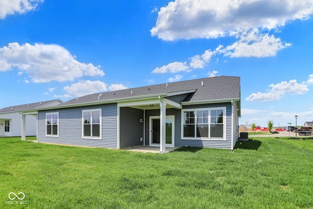 104 Maxim Ct, Cumberland, IN 46229 - rear view of house with a patio area, a yard, and central AC unit