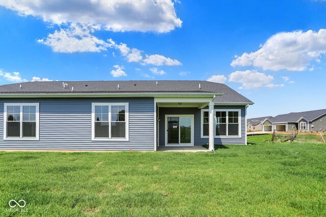 104 Maxim Ct, Cumberland, IN 46229 - back of property with a patio area and a lawn