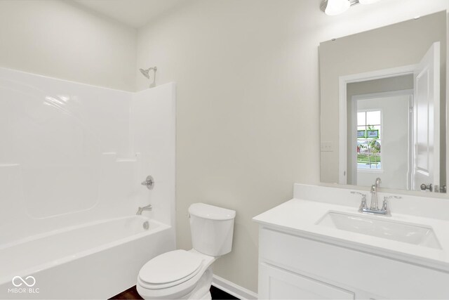 104 Maxim Ct, Cumberland, IN 46229 - bathroom featuring vanity, toilet, shower / bathtub combination, and baseboards