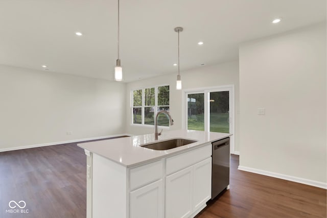 104 Maxim Ct, Cumberland, IN 46229 - kitchen featuring a sink, dishwasher, dark wood-style floors, light countertops, and pendant lighting