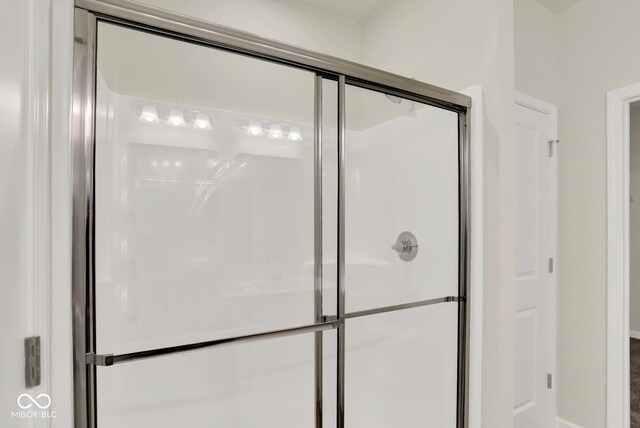 104 Maxim Ct, Cumberland, IN 46229 - full bathroom with a stall shower and baseboards