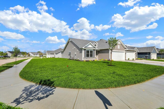 104 Maxim Ct, Cumberland, IN 46229 - view of front of home featuring driveway, a front yard, a garage, and a residential view