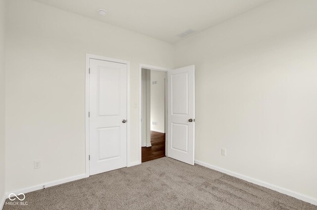 104 Maxim Ct, Cumberland, IN 46229 - unfurnished bedroom with carpet floors and baseboards