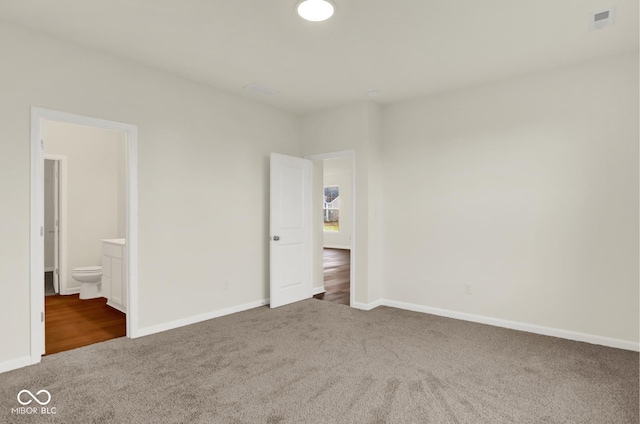 104 Maxim Ct, Cumberland, IN 46229 - unfurnished bedroom featuring carpet flooring, baseboards, and connected bathroom