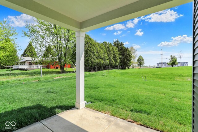 104 Maxim Ct, Cumberland, IN 46229 - view of grassy yard featuring a patio area