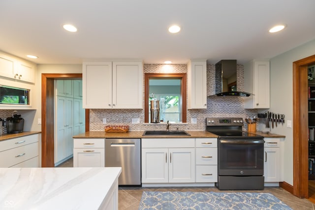 1541 Stadium Dr, Seymour, IN 47274 - kitchen featuring electric stove, stainless steel dishwasher, wall chimney exhaust hood, a sink, and tasteful backsplash