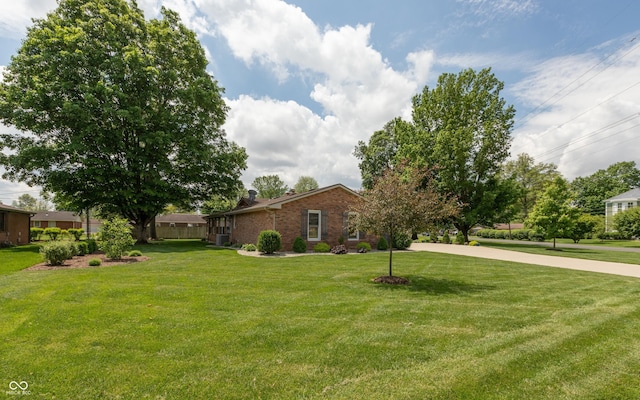 1541 Stadium Dr, Seymour, IN 47274 - view of front of home with brick siding and a front lawn
