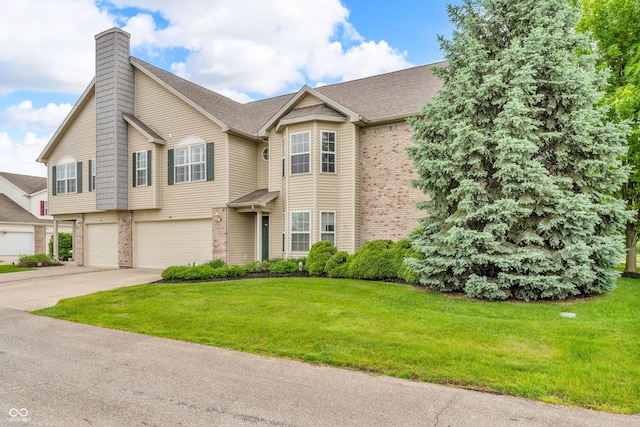1139 Fernwood Way, Plainfield, IN 46168 - view of front facade featuring brick siding, a chimney, a garage, concrete driveway, and a front lawn