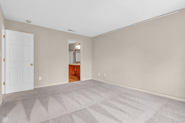1139 Fernwood Way, Plainfield, IN 46168 - unfurnished bedroom with carpet floors, baseboards, and ensuite bathroom
