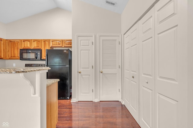1139 Fernwood Way, Plainfield, IN 46168 - kitchen featuring black appliances, dark wood-style floors, light stone counters, and high vaulted ceiling