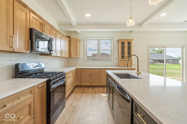 4251 Coventry Dr, Kokomo, IN 46902 - kitchen with stainless steel appliances, a sink, beamed ceiling, light wood-style flooring, and light stone countertops
